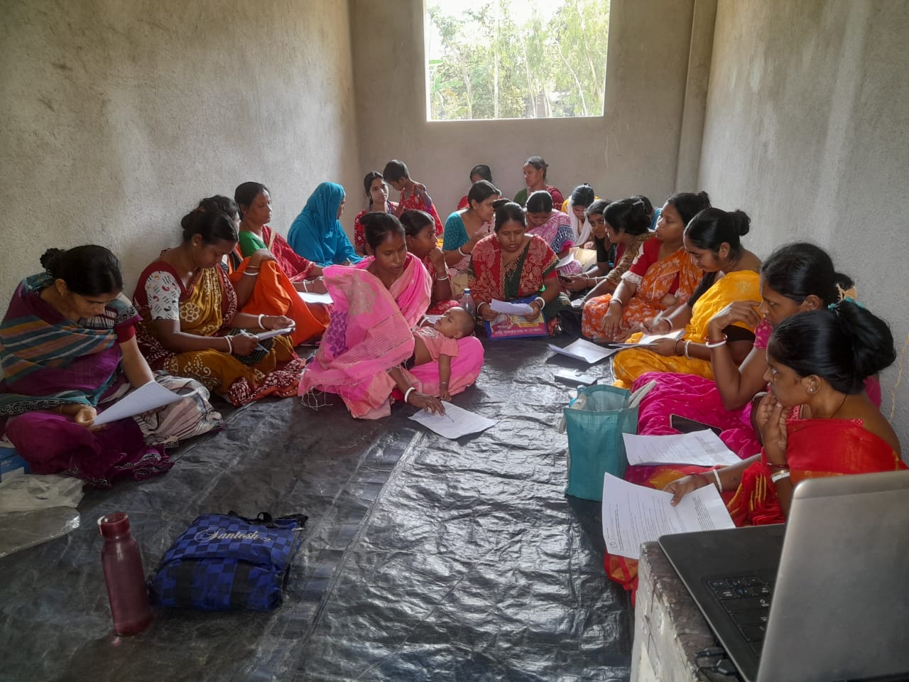 Community women gathered for an awareness and literacy meeting